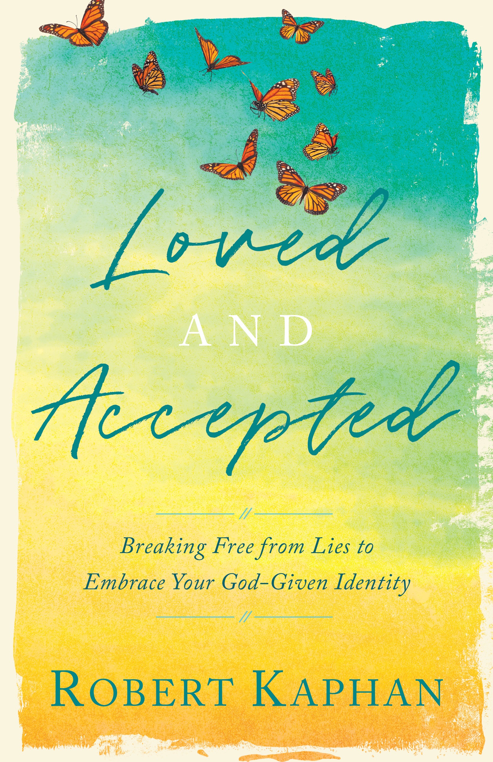 Book cover with a turquoise-to-yellow gradient and butterflies. Text reads "Loved and Accepted" by Robert Kaphan, with a motivational subtitle.